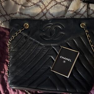 CHANEL Black Shoulder Bag with Gold Accents